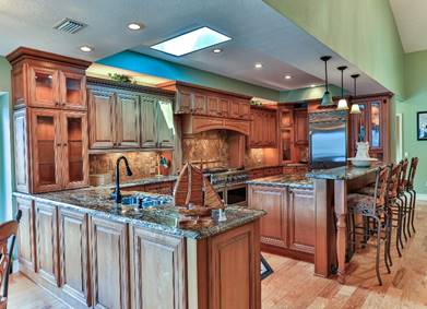 A kitchen with wooden cabinets  Description automatically generated with low confidence