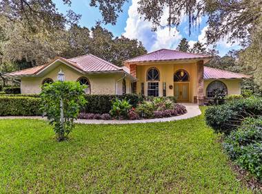 A picture containing grass, outdoor, house, tree  Description automatically generated